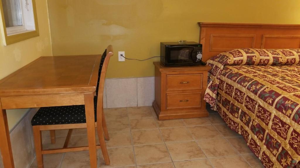 Postel nebo postele na pokoji v ubytování Luxury Inn