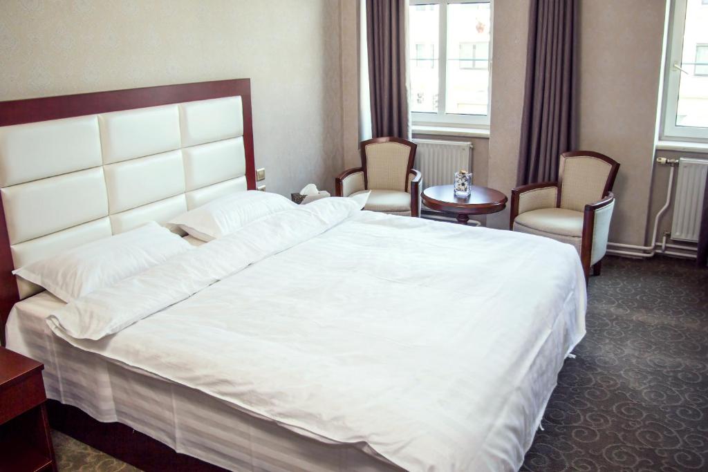 Posteľ alebo postele v izbe v ubytovaní Hotel MUSE