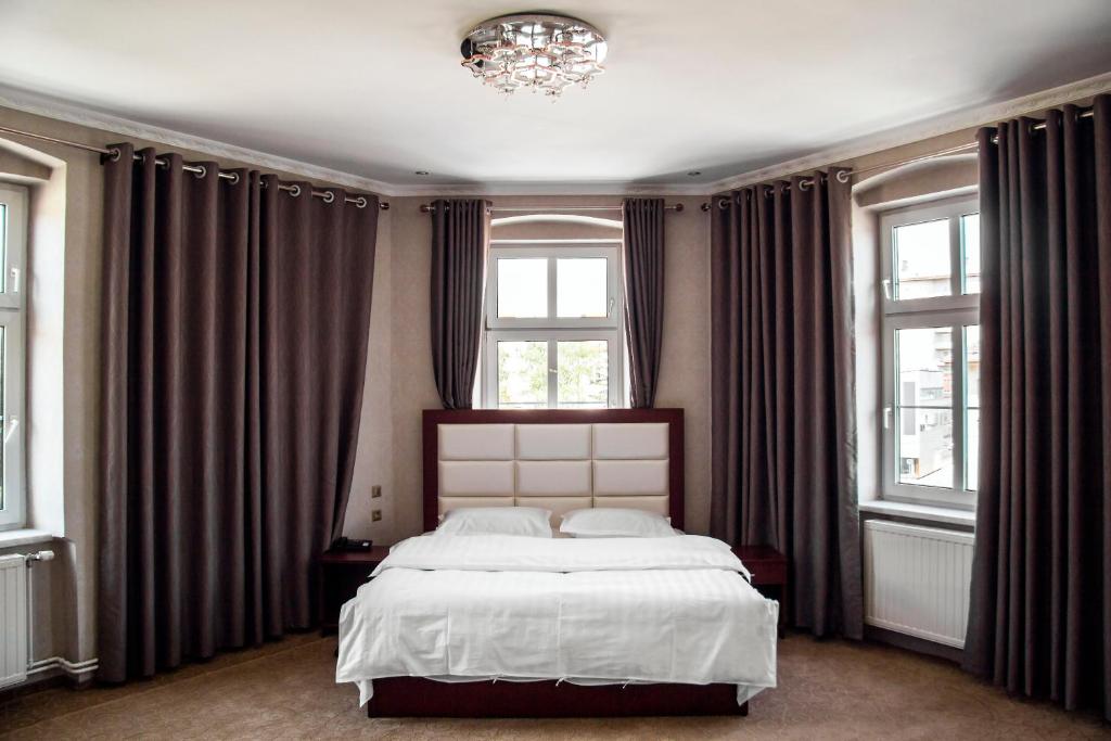 Posteľ alebo postele v izbe v ubytovaní Hotel MUSE