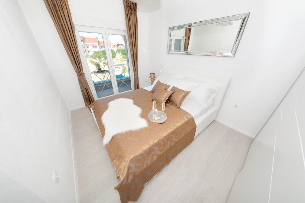 Łóżko lub łóżka w pokoju w obiekcie Apartments Tija Exclusive
