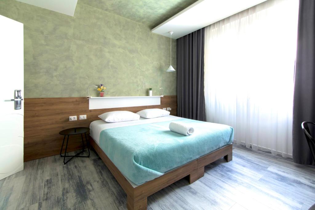 Postel nebo postele na pokoji v ubytování Urban Rooms