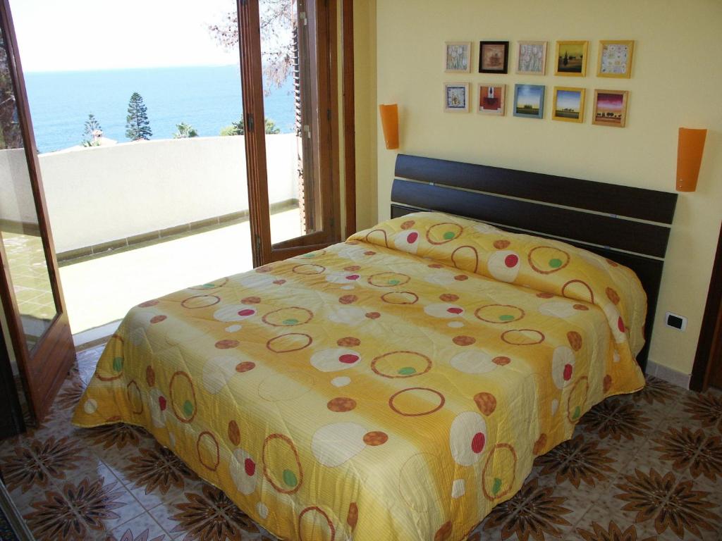 Postel nebo postele na pokoji v ubytování Terrazza sul Plemmirio