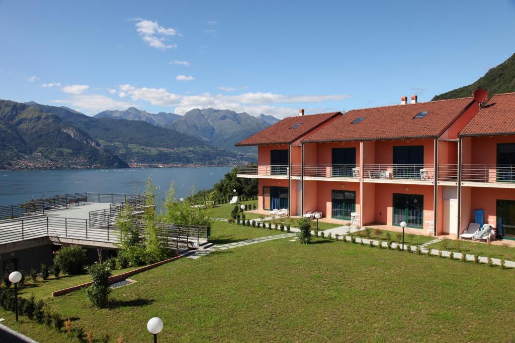 a large house with a view of a lake at Residence Oasi Del Viandante in Dervio