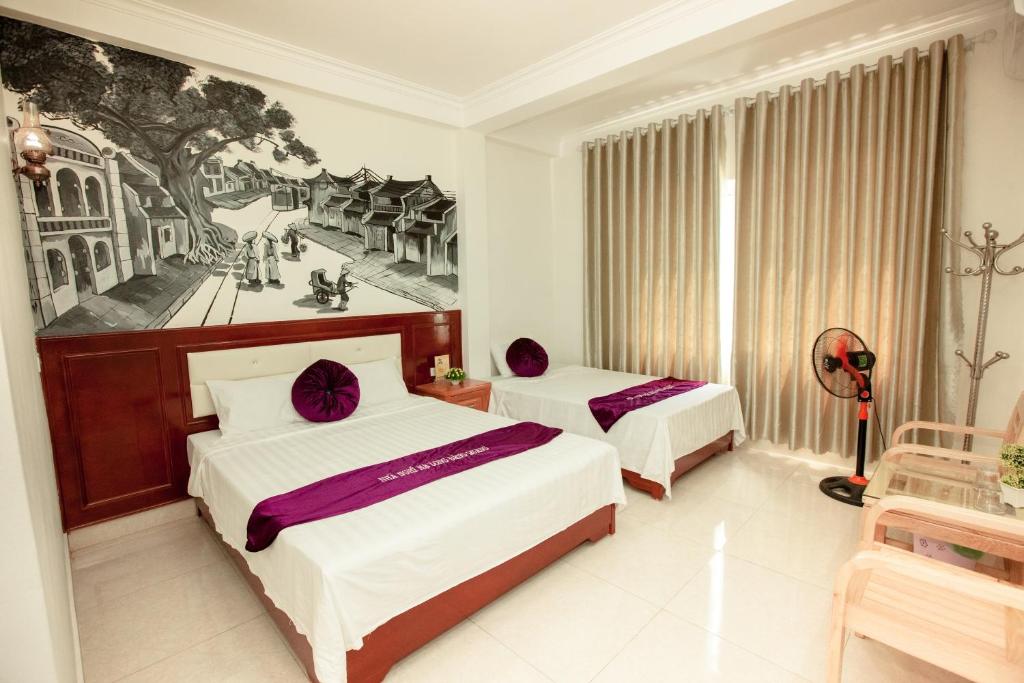 Postel nebo postele na pokoji v ubytování Dang Quang Guesthouse