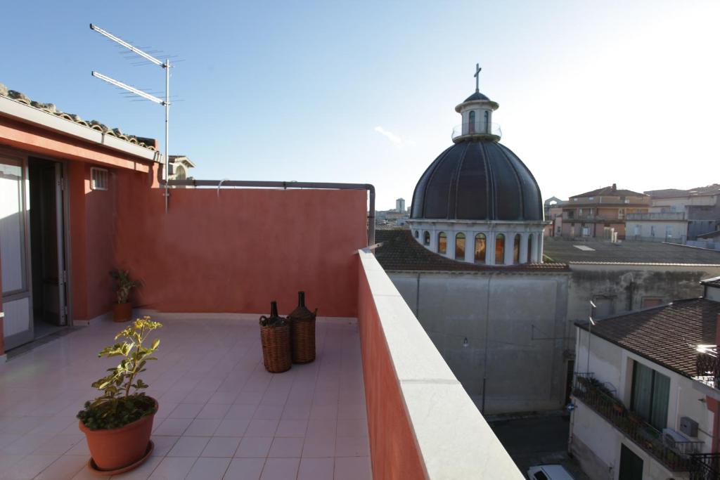 a balcony with a view of a building at Case Francesco in Ragusa