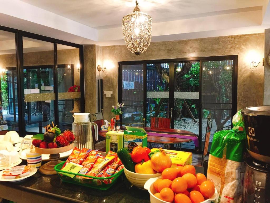 a kitchen with fruits and vegetables on a counter at G2 Boutique Hotel in Chiang Mai