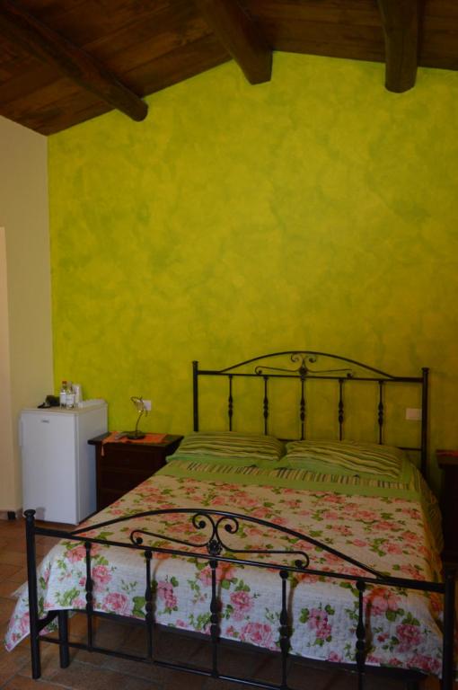 Łóżko lub łóżka w pokoju w obiekcie Agriturismo E Turre