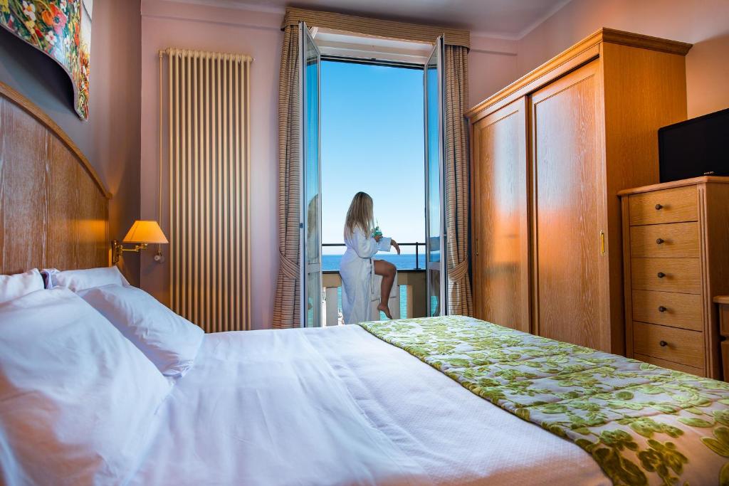 Posteľ alebo postele v izbe v ubytovaní Hotel Ligure