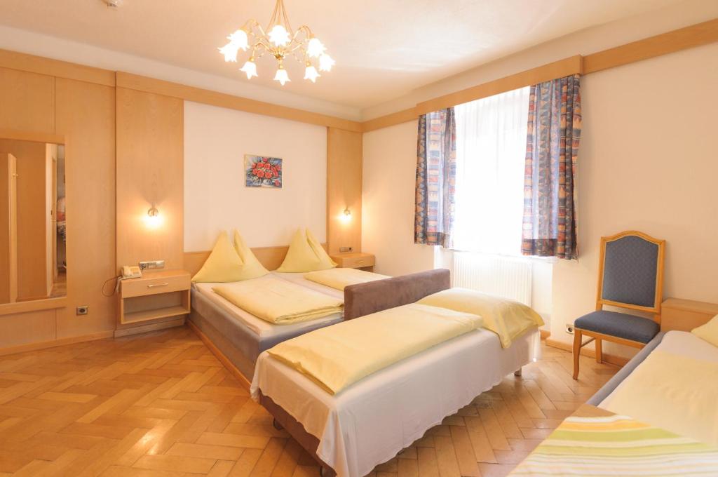 Postel nebo postele na pokoji v ubytování Hotel Tautermann