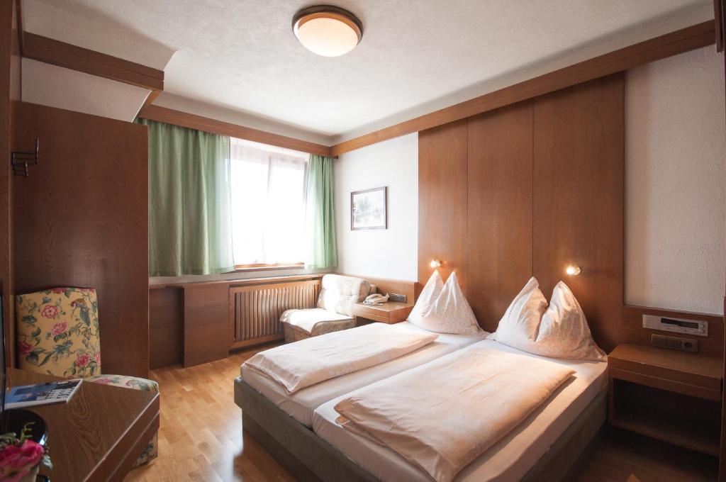 Postel nebo postele na pokoji v ubytování Hotel Tautermann