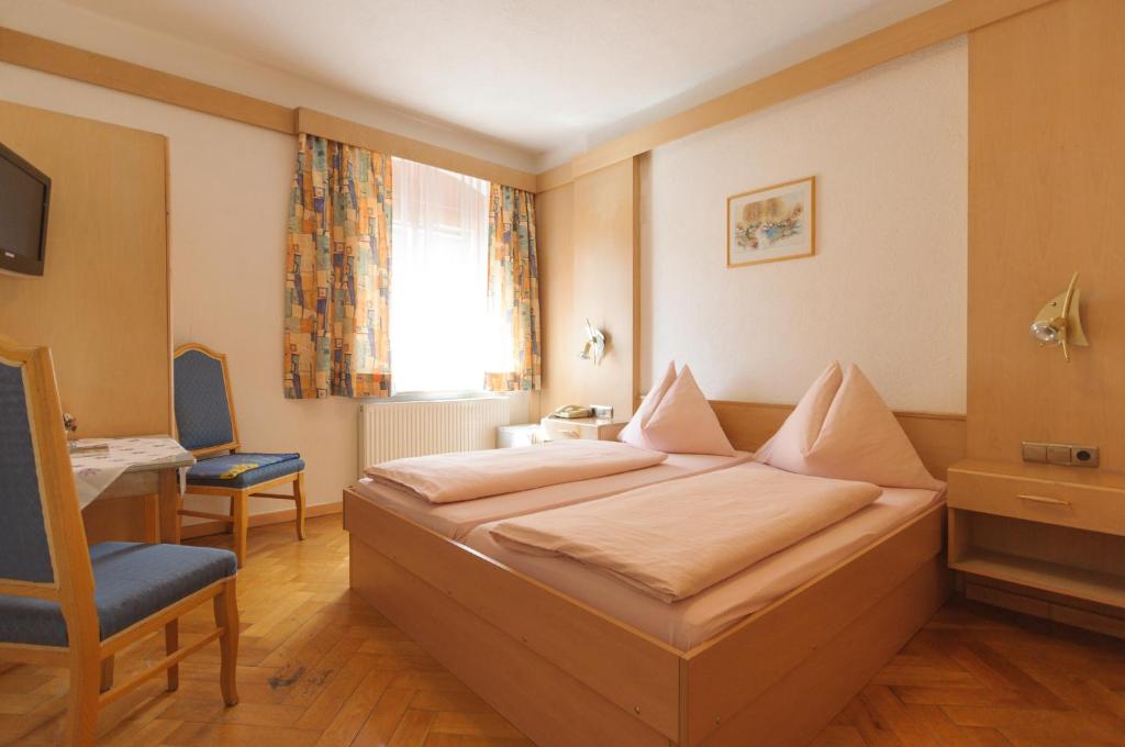Postel nebo postele na pokoji v ubytování Hotel Tautermann