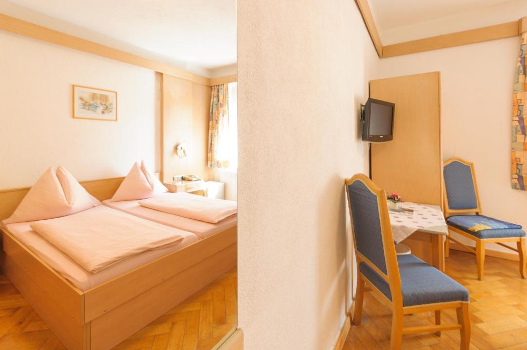 Postel nebo postele na pokoji v ubytování Hotel Tautermann