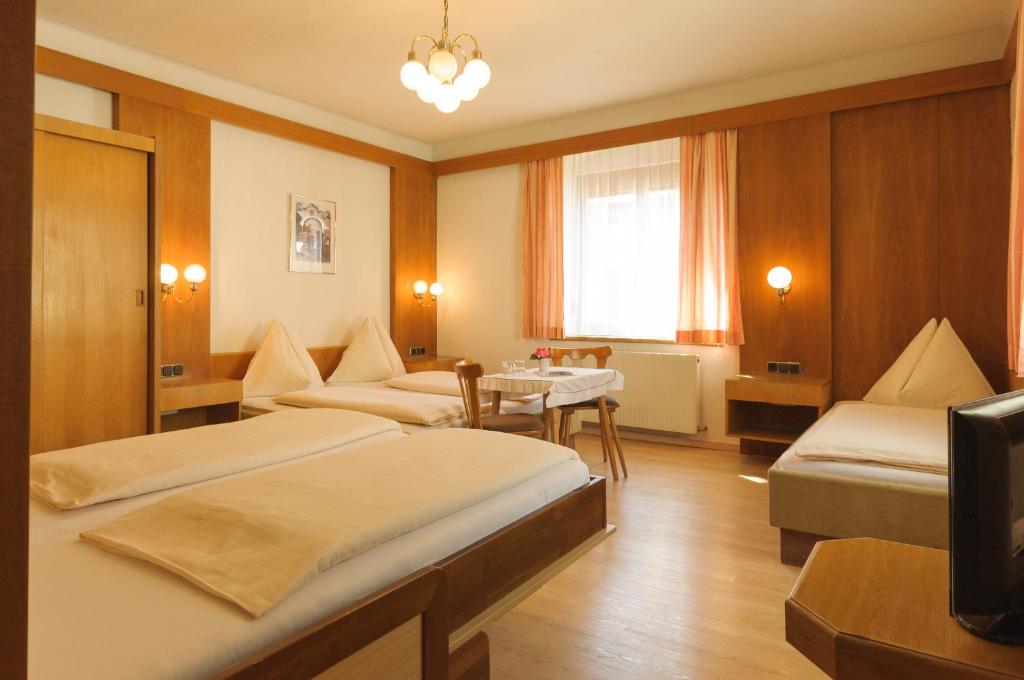 Postel nebo postele na pokoji v ubytování Hotel Tautermann