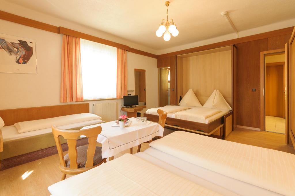 Postel nebo postele na pokoji v ubytování Hotel Tautermann