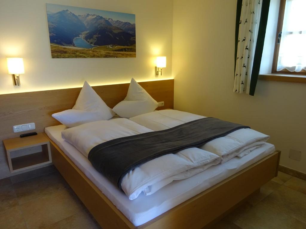Posteľ alebo postele v izbe v ubytovaní Steigerhütte