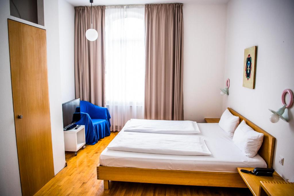 Postel nebo postele na pokoji v ubytování Art-Hotel Robert Mayer