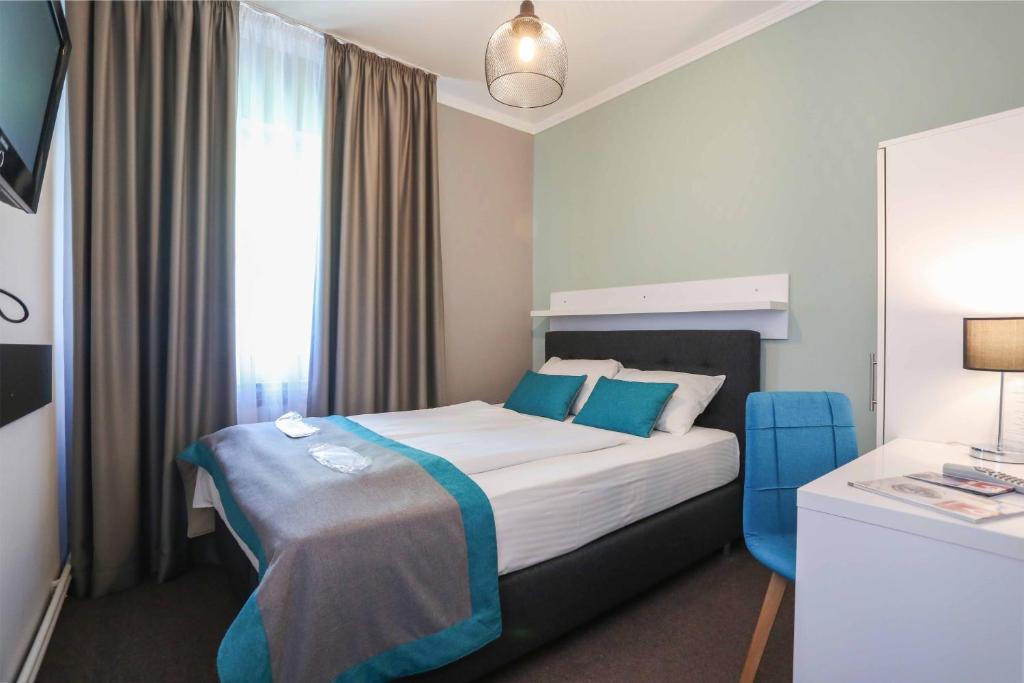 Una cama o camas en una habitación de Hotel Sokak