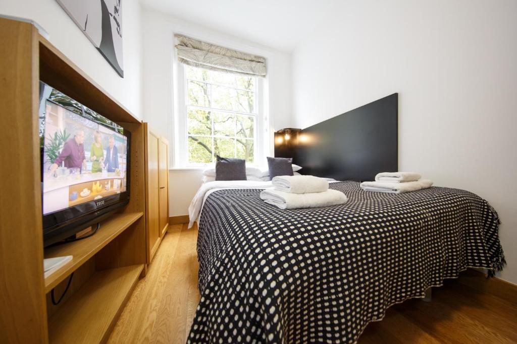 TV a/nebo společenská místnost v ubytování Studios2Let