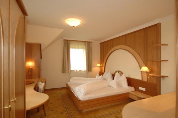 Postel nebo postele na pokoji v ubytování Hotel Neuwirt