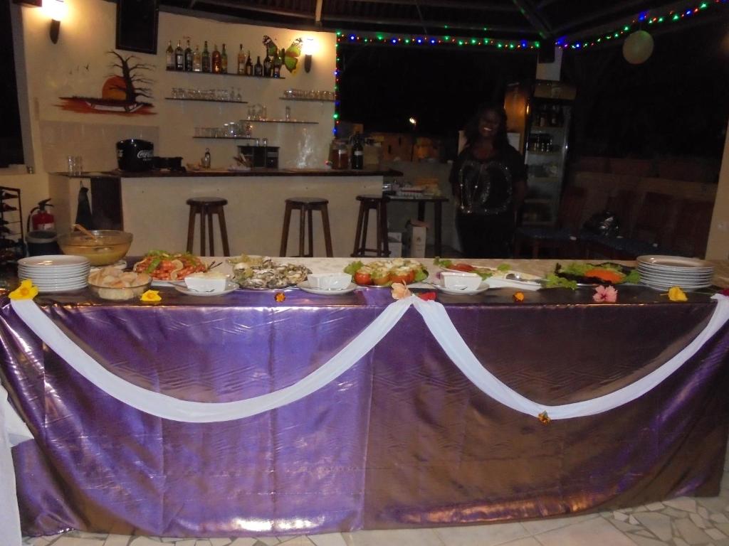 a table with a buffet of food on it at Bolongs Passion in Cap Skirring