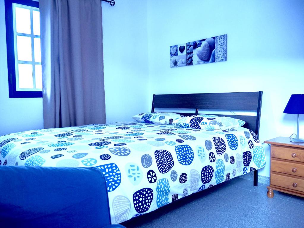 Postel nebo postele na pokoji v ubytování Casa Suso & casa Margarita