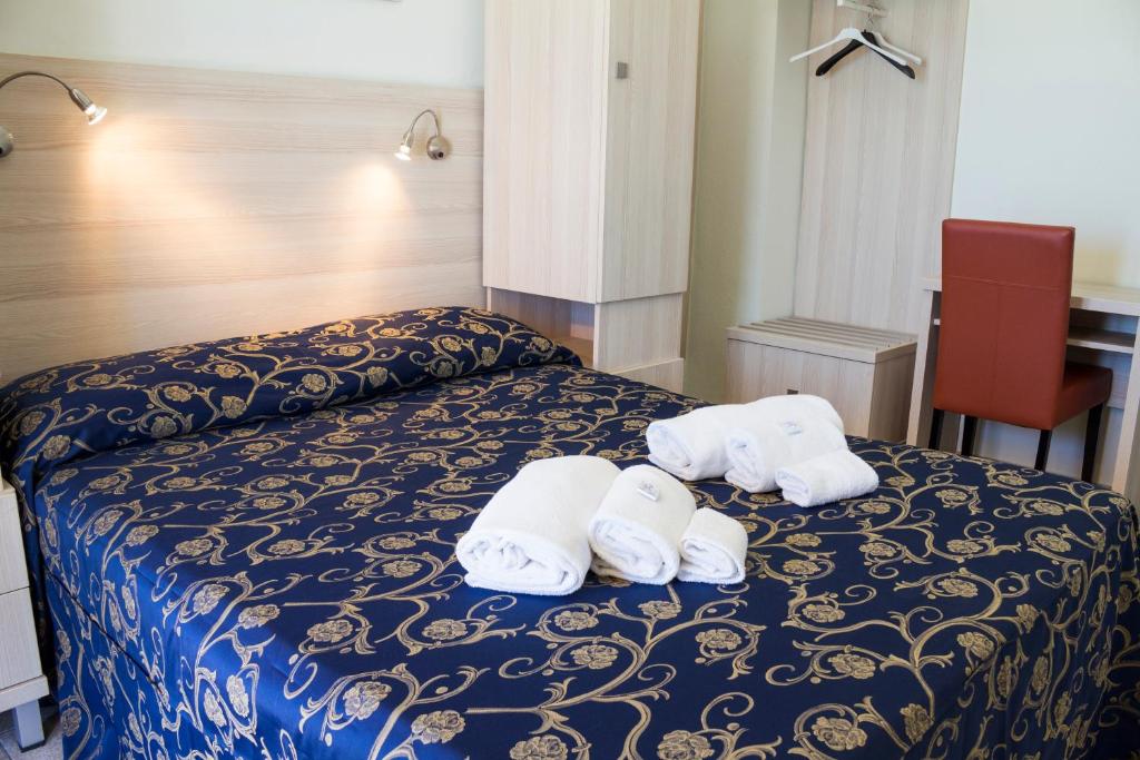 Postel nebo postele na pokoji v ubytování Hotel Villa La Brise