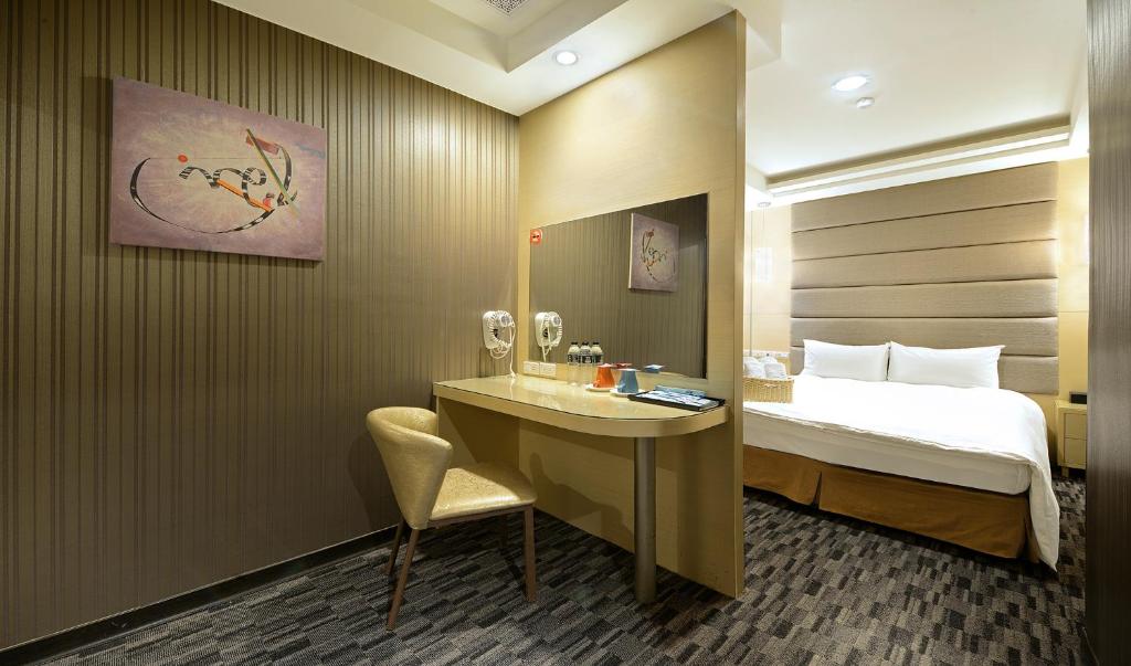 Postel nebo postele na pokoji v ubytování IN99 Hotel