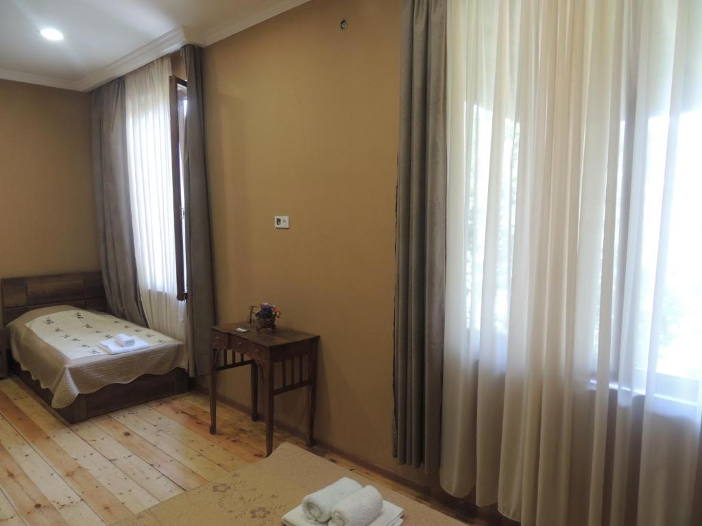 Postel nebo postele na pokoji v ubytování Guest House Chirina