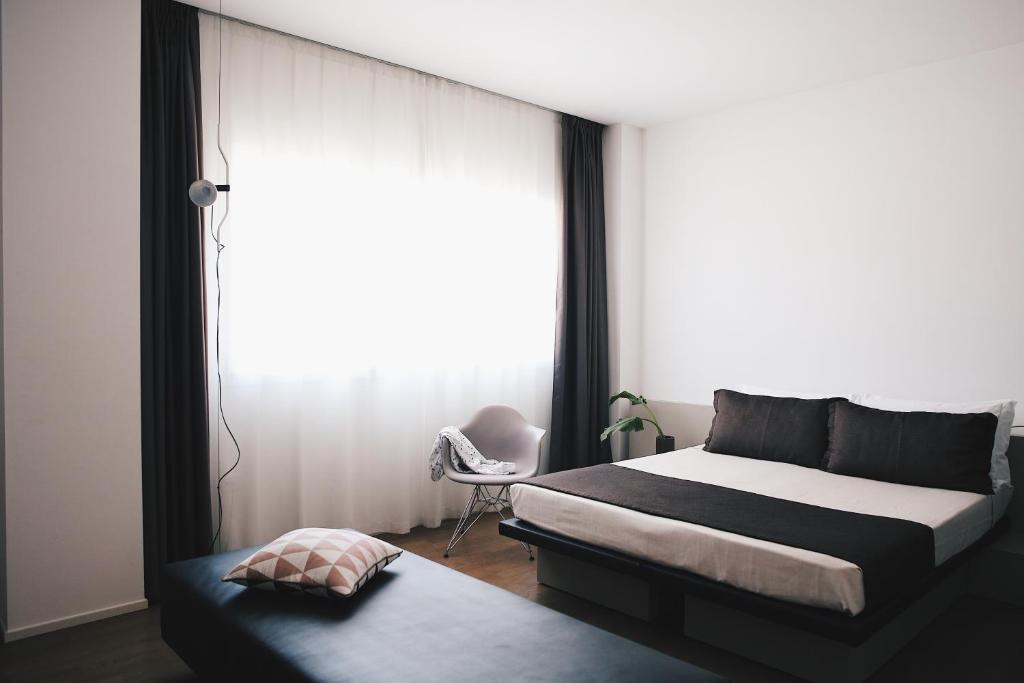 Postel nebo postele na pokoji v ubytování Le Nove Hotel