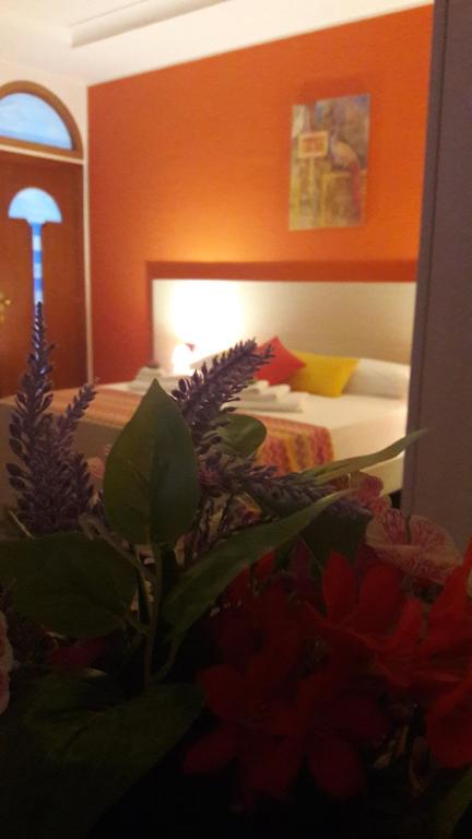 Łóżko lub łóżka w pokoju w obiekcie B&B Cornelia