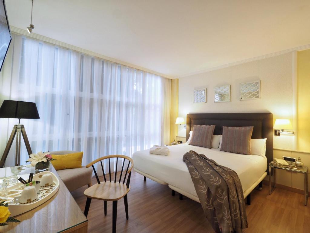 Postel nebo postele na pokoji v ubytování Vilana Hotel Boutique