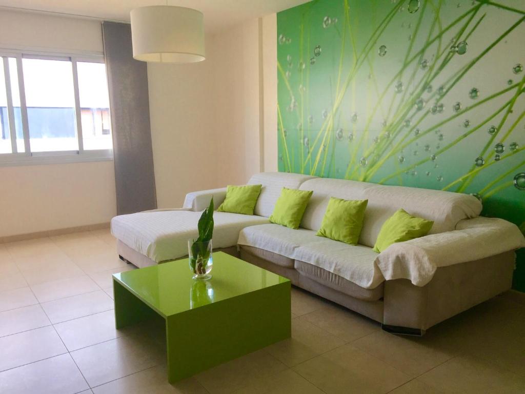 a living room with a couch and a table at Apartamento Atlántico in Vecindario