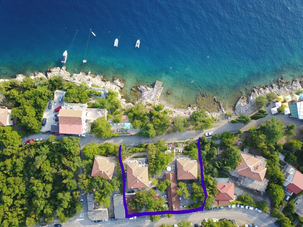 an aerial view of a house next to the water at Rooms Villa Lucija in Kraljevica