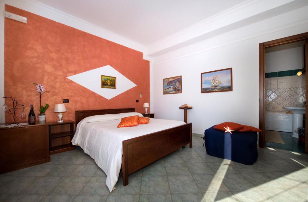 A bed or beds in a room at H.H.Le Palme
