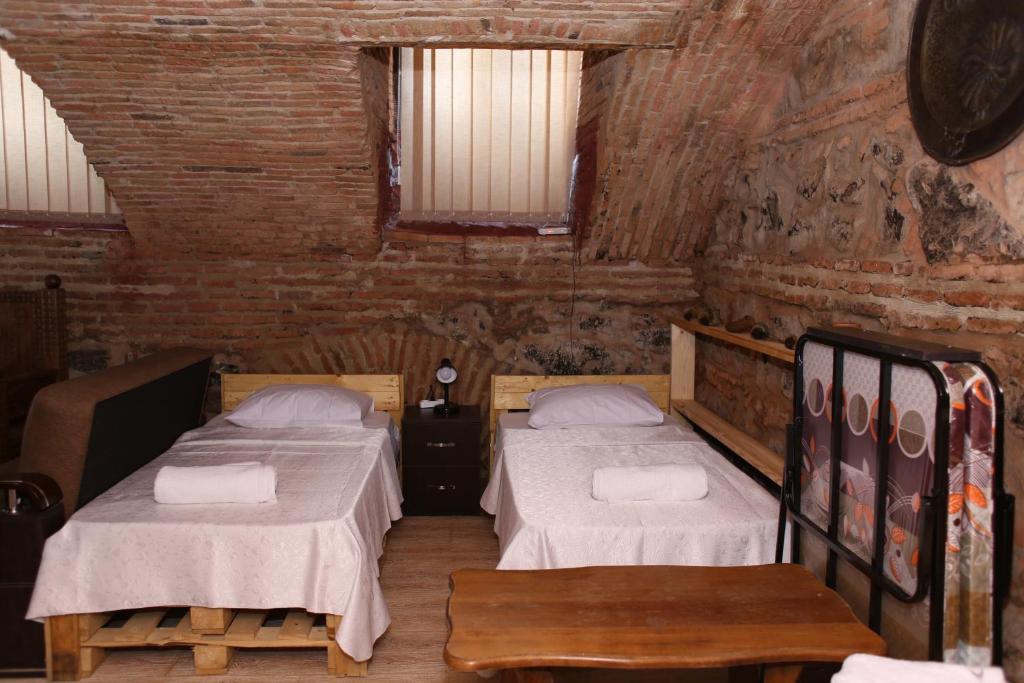 Postel nebo postele na pokoji v ubytování Guest House Kakabadzeebi 9