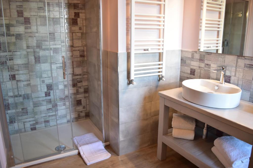 a bathroom with a sink and a shower at Villa San Michele in Barberino di Val dʼElsa