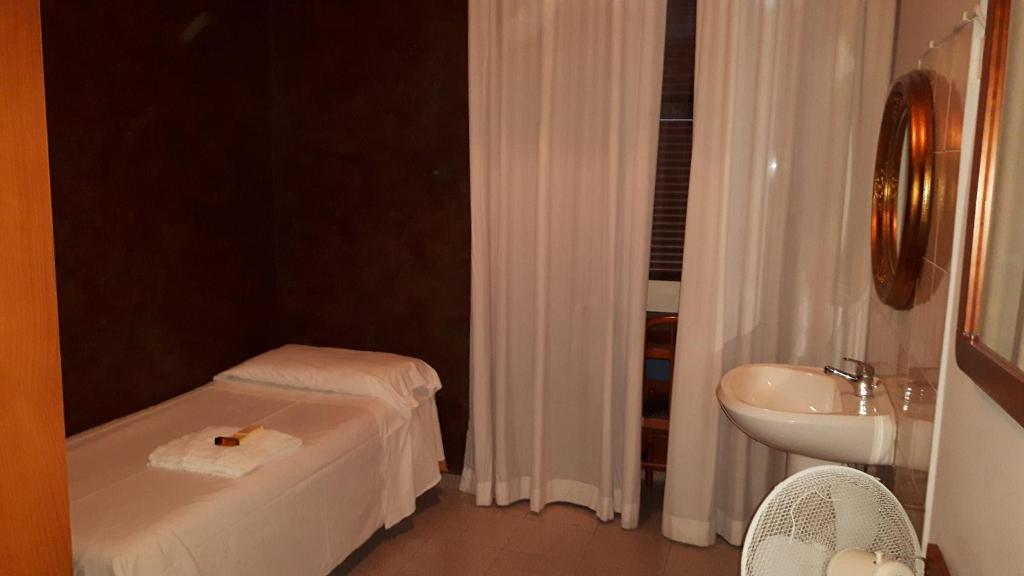 Een badkamer bij Hotel Gloria