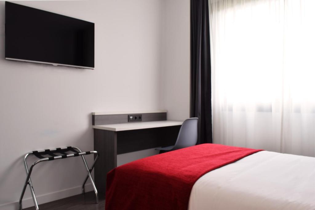 TV a/nebo společenská místnost v ubytování Hotel New Bilbao Airport