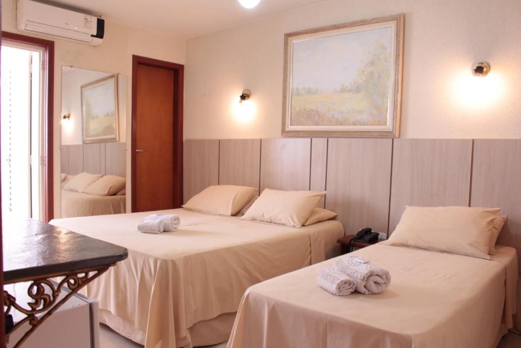 Кровать или кровати в номере Hotel Santa Rita Itu