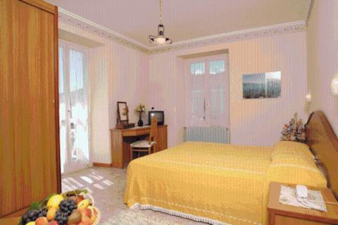 Postel nebo postele na pokoji v ubytování Hotel Brisino