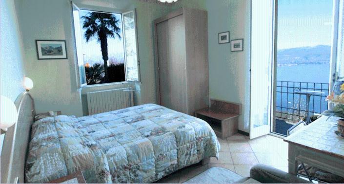 Postel nebo postele na pokoji v ubytování Hotel Brisino