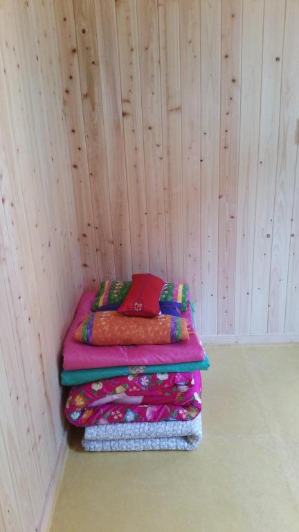 Postel nebo postele na pokoji v ubytování Jeongga Hanok