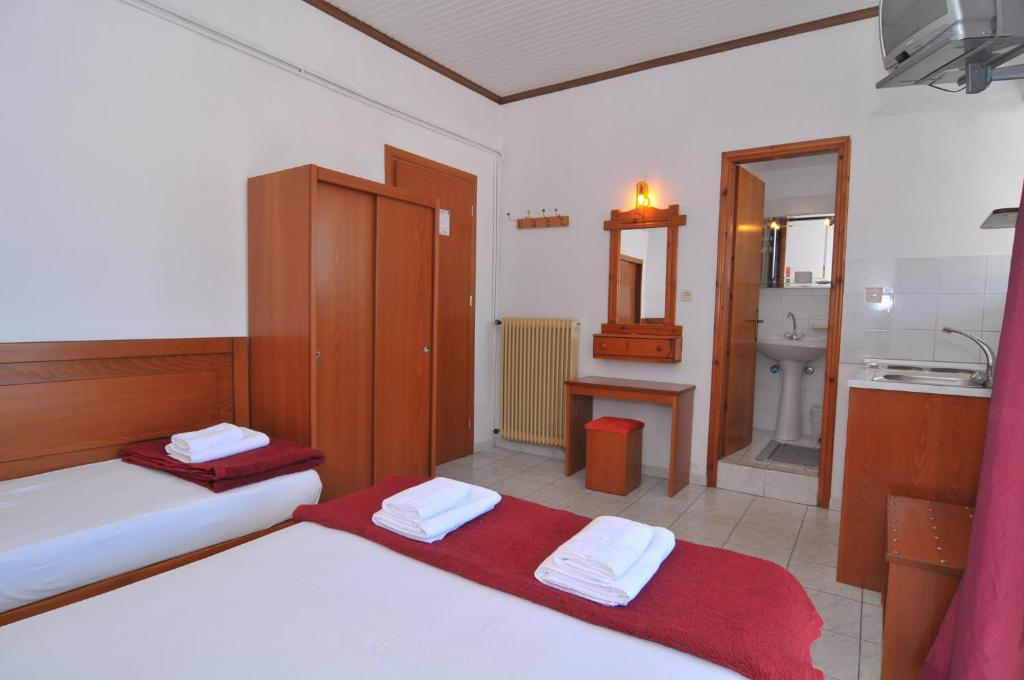 Postel nebo postele na pokoji v ubytování Hotel Elvetia