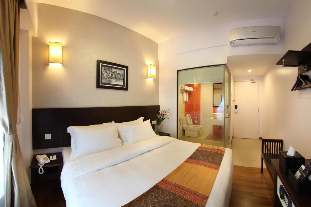 Postel nebo postele na pokoji v ubytování Hotel Richbaliz Selayang