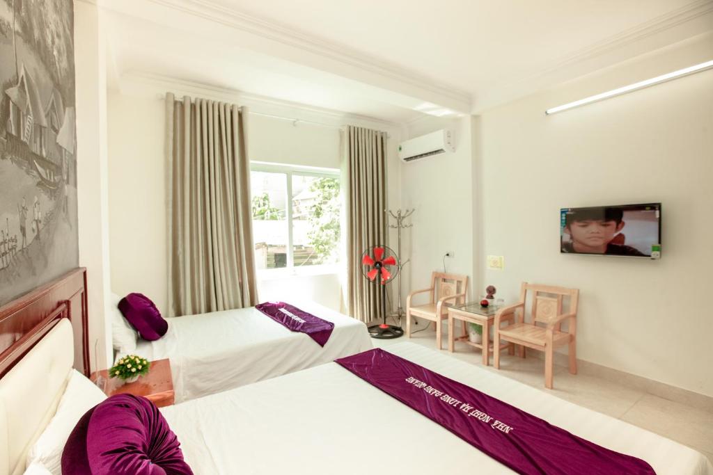 Postel nebo postele na pokoji v ubytování Dang Quang Guesthouse