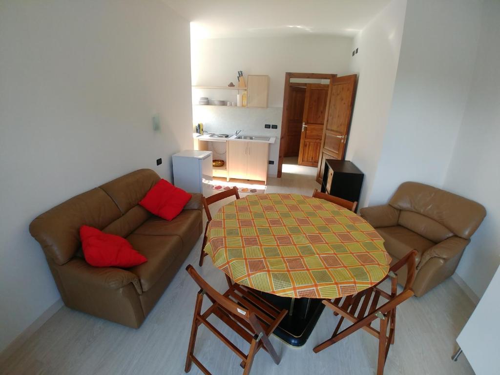 a living room with a couch and a table at Agriturismo Bastià in Corio