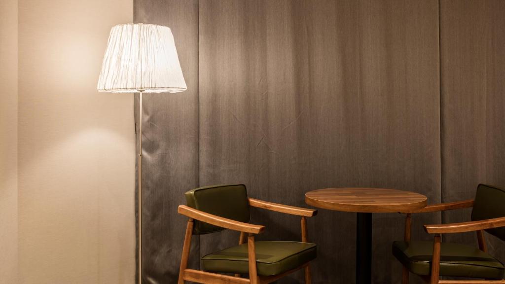 Posezení v ubytování The First Stay Hotel