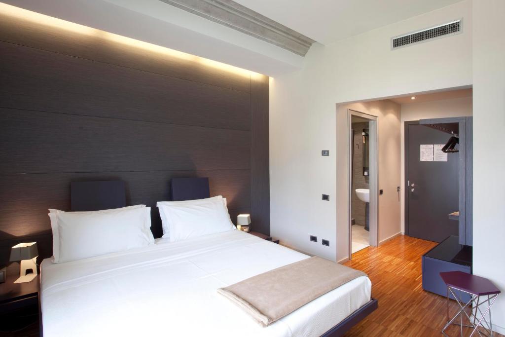 Postel nebo postele na pokoji v ubytování Alter Hotel