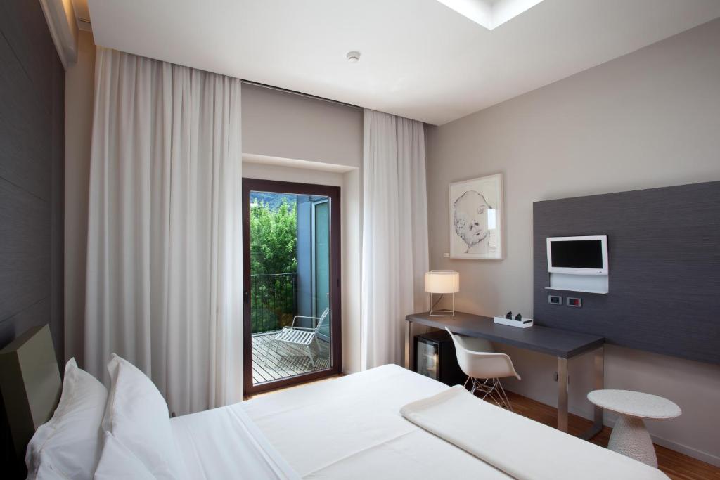 Postel nebo postele na pokoji v ubytování Alter Hotel