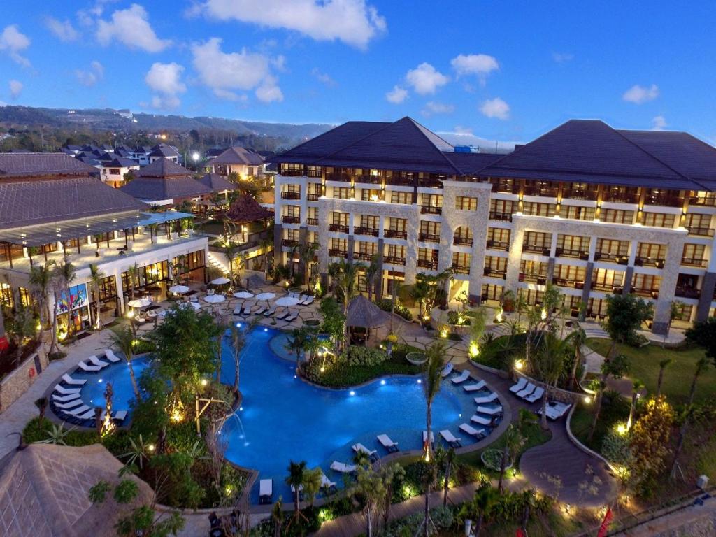 an aerial view of a resort with a pool at Royal Tulip Springhill Resort Jimbaran in Jimbaran